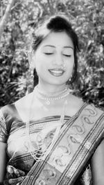 Portrait of a smiling young woman outdoors