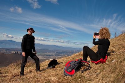 Mature couple hiking on the mountain ridge