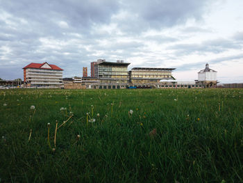 View of buildings against cloudy sky