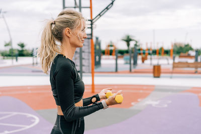 Young woman exercising in gym