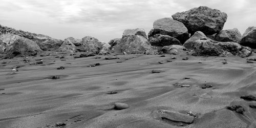 Rocks on land against sky