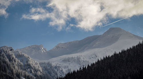 Panoramic view of snowcapped mountains against sky