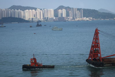 Ship sailing in sea against sky