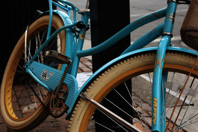 Close-up of bicycle wheel against sky