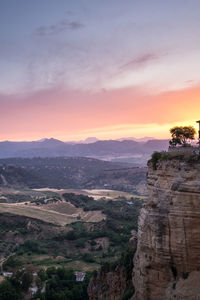 Scenic view of landscape against sky during sunset