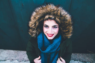 Portrait of a smiling young woman in winter