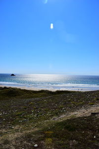 Scenic view of sea against clear blue sky