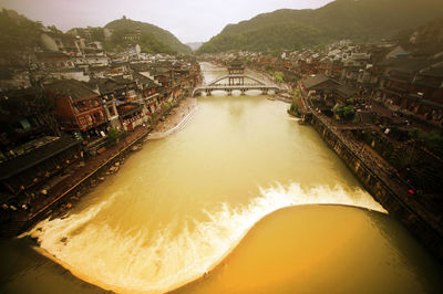 Scenic view of river in city