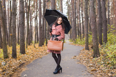 Woman walking in forest