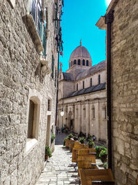 Alley amidst buildings in city