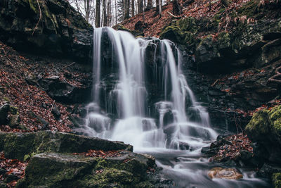 Frosty waterfall tosanovsky in autumn colours. beskydy mountains in eastern czech republic