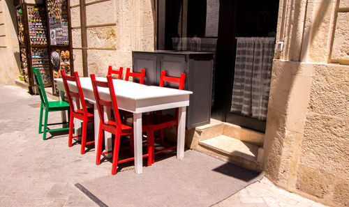 Empty chairs and tables in building