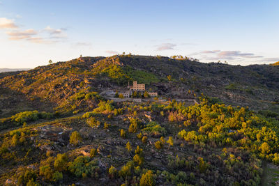 Drone aerial panorama of termas radium hotel serra da pena at sunset in sortelha, portugal