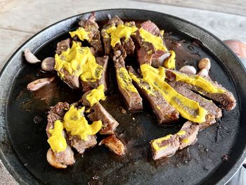 High angle view of meat on barbecue grill