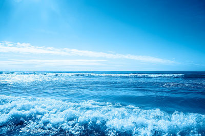 Scenic view of sea against blue sky