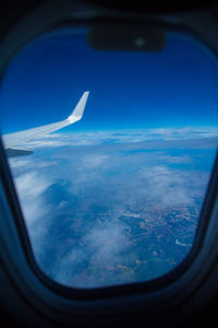 Aerial view of clouds seen from airplane window