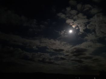 Low angle view of moon in sky at night