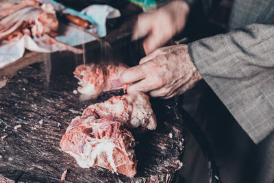 Midsection of person preparing food