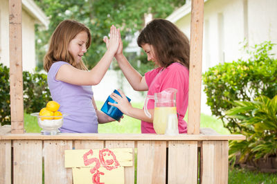 Side view of two women drinking water