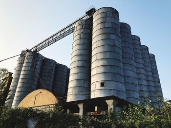 Low angle view of factory against sky