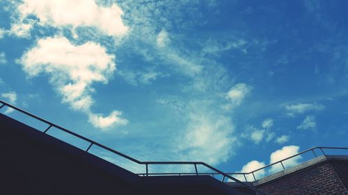 Low angle view of railing against sky