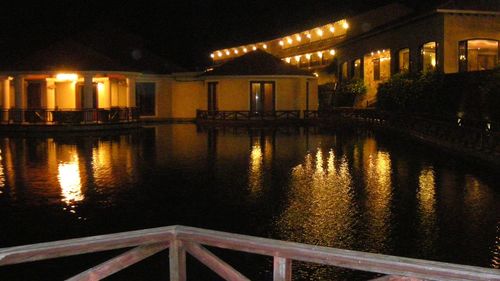 Reflection of illuminated buildings in water at night