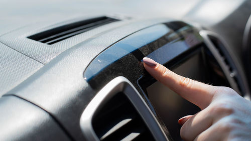 Close-up of hand holding car