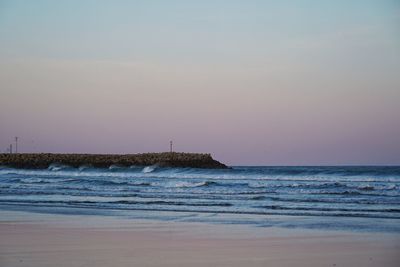 Scenic view of sea against sky at sunset