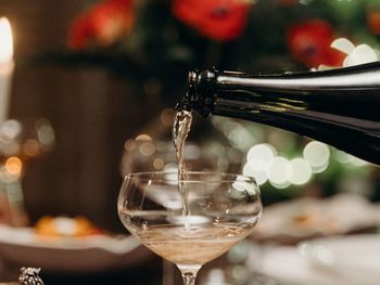 Close-up of wineglasses on table