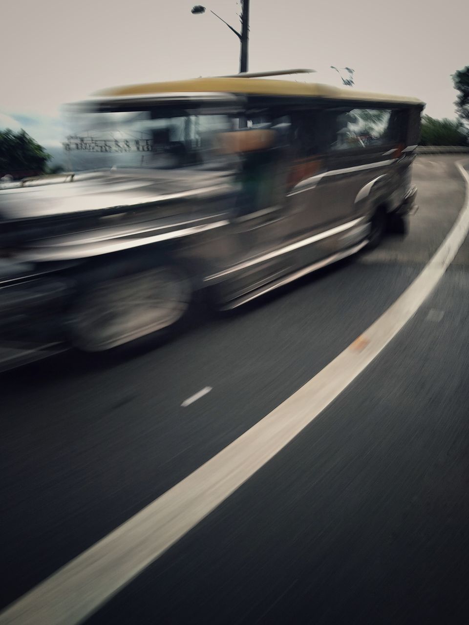 BLURRED MOTION OF CAR ON STREET