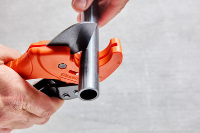 Cropped hand of man repairing car