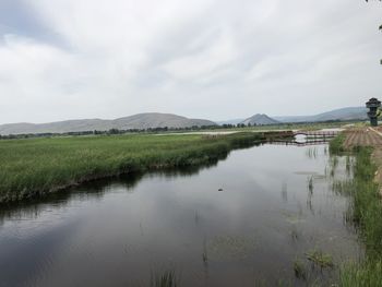 Scenic view of lake against sky