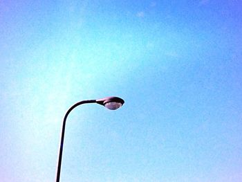 Low angle view of street light against clear blue sky
