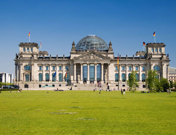 People in front of historical building