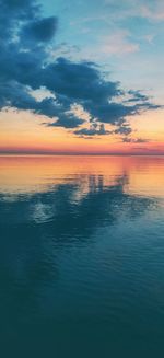 Scenic view of sea against sky at sunset