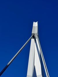Low angle view of sailboat against clear blue sky