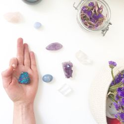 Directly above shot of woman hand on white table