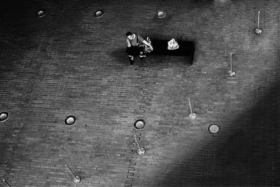 High angle view of people walking on wall