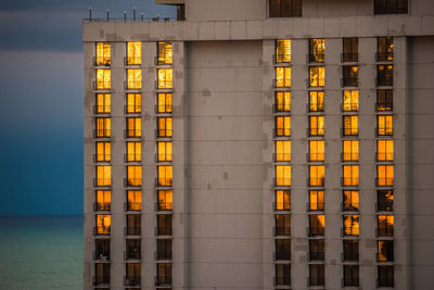 Low angle view of buildings in the dark