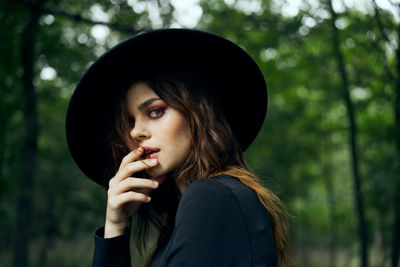 Portrait of young woman in forest