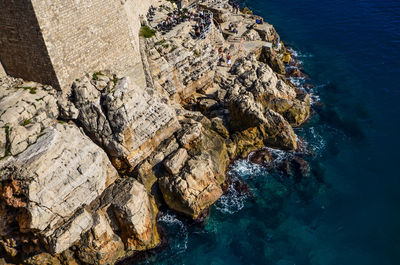 High angle view of rock formation at sea