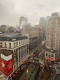 High angle view of street amidst buildings in city