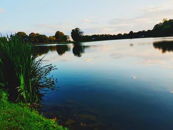 Scenic view of lake against sky during sunset