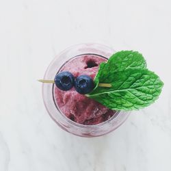 High angle view of berries in glass on table