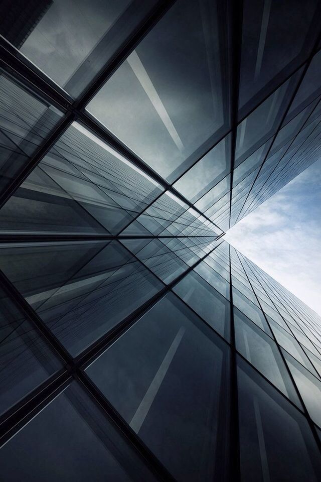 low angle view, architecture, built structure, modern, building exterior, glass - material, office building, sky, city, skyscraper, tall - high, building, reflection, directly below, tower, pattern, glass, no people, day, window