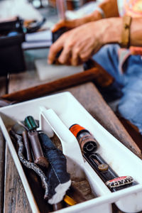 Close-up of man with tools on table