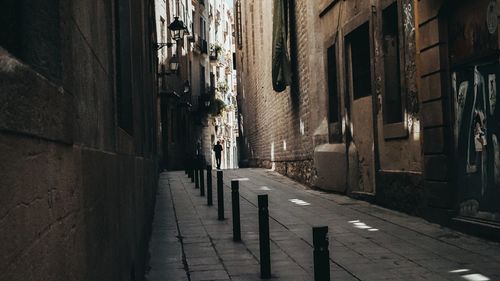 Narrow alley amidst buildings in city