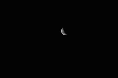 Low angle view of moon against clear sky at night