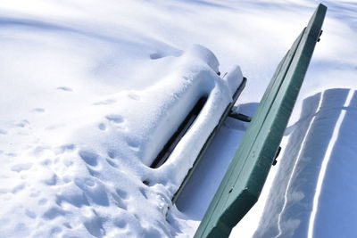 Close-up of frozen car against sky