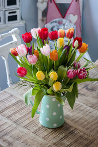 Close-up of tulips in vase on table, country style